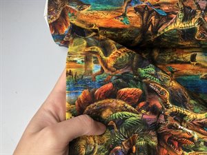 Bomuldsjersey - dinosaurer i juratiden i varme toner